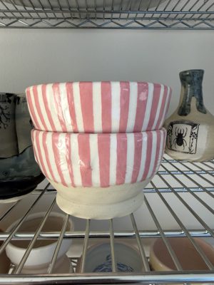 Stacked pink and white striped bowls