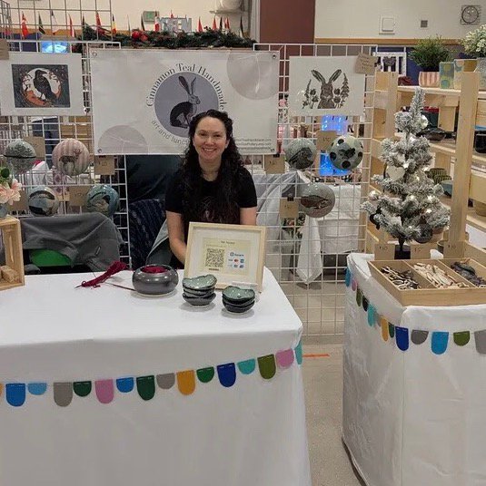 Cinnamon Teal Handmade booth at a craft fair